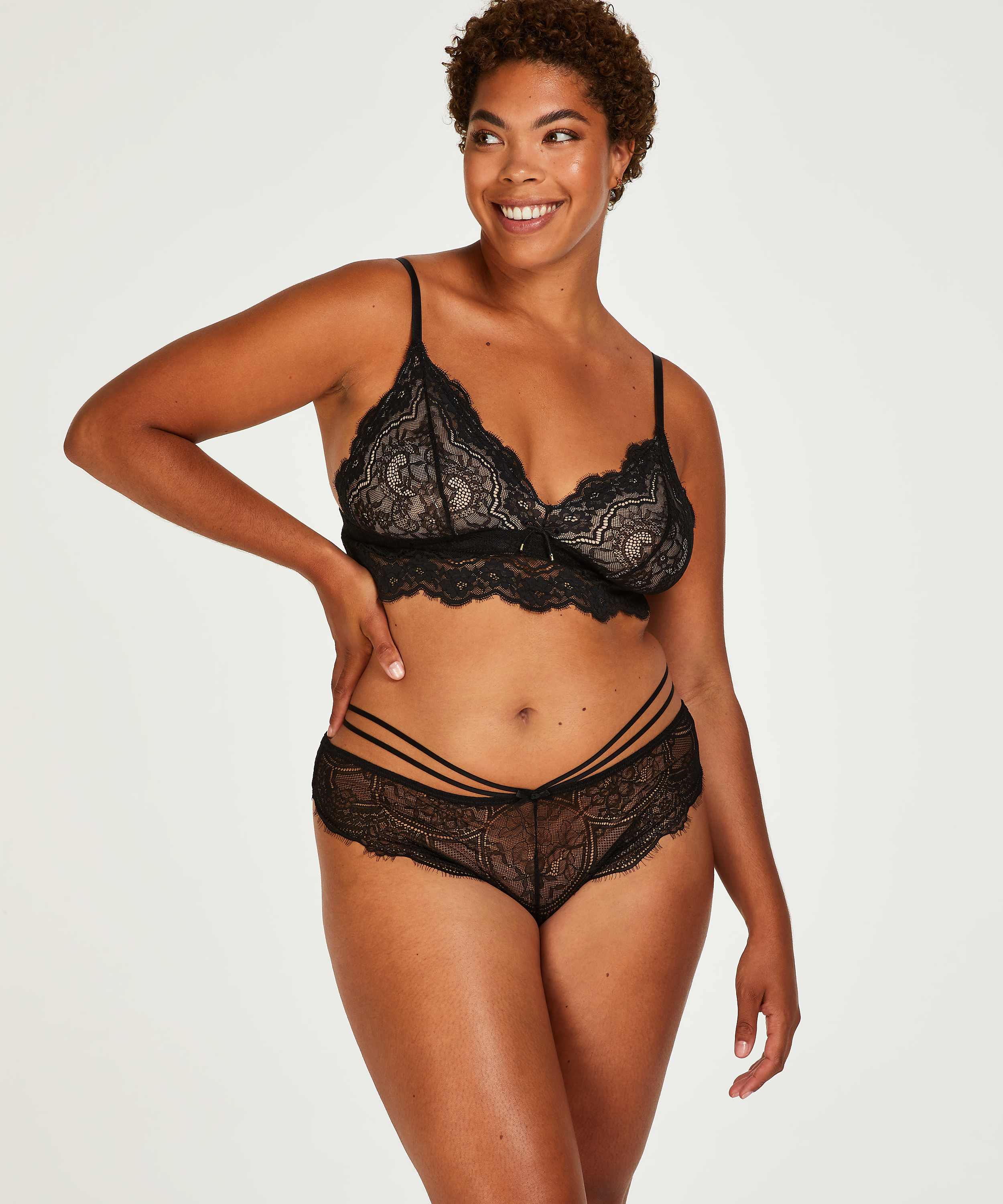 Slip brésilien échancré Sian, Noir, main